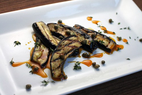 grilled eggplant saffron honey sauce capers and manchego